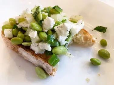 Edamame, Fennel, and mint salad served on bread