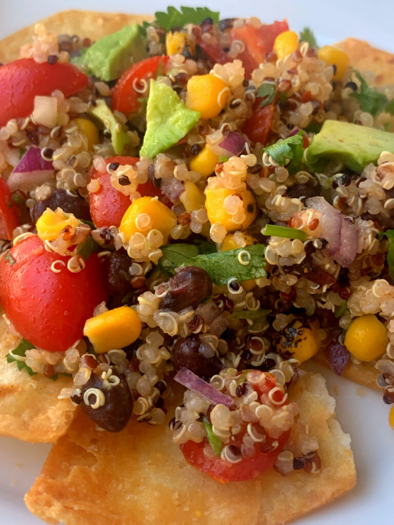 Quinoa salad on a bed of tortilla chips